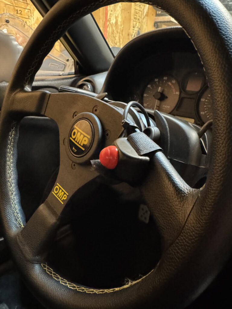 Steering wheel PTT button